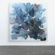 Minimalistic interior with an empty white wall and stone floor