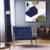 Navy Blue Armchair Next To Lamp In Sophisticated Apartment Inter