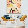 Pouf And Table In Front Of Mustard Couch And Wooden Lamp In Flat