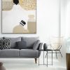 Lamp Above Grey Couch With Pillows In White Living Room Interior