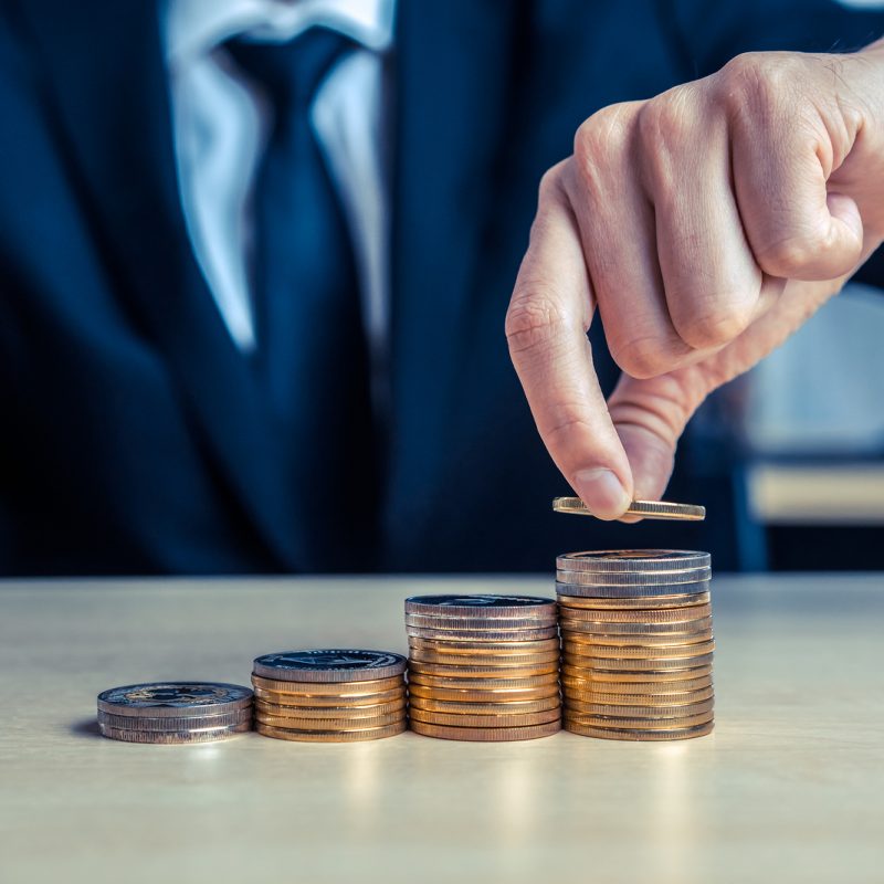 Businessman Working With Coin Money Currency.
