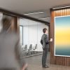 Man Looking At Poster In Office