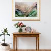 Blank Picture Frame Above A Side Table With Flowers And Pot Plant
