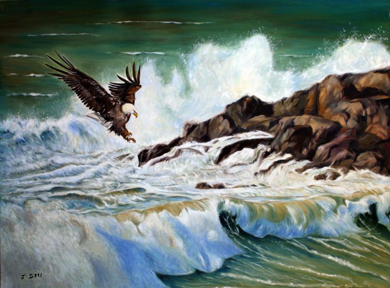 Eagle flying over big waves