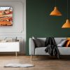 Orange Lamps Above Grey Couch In Black Living Room Interior With