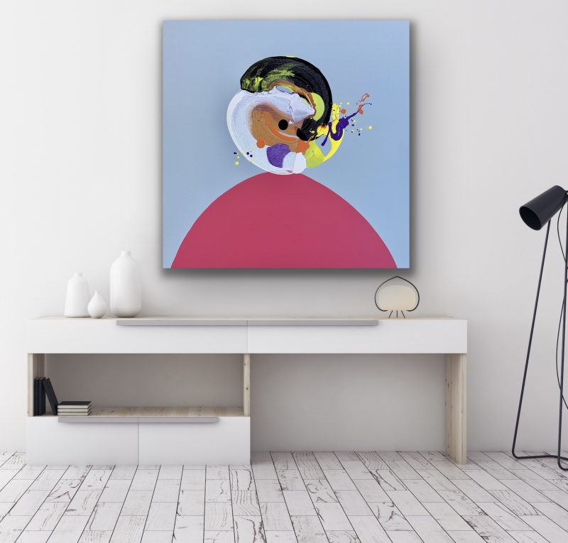 Jon wears a pink shirt