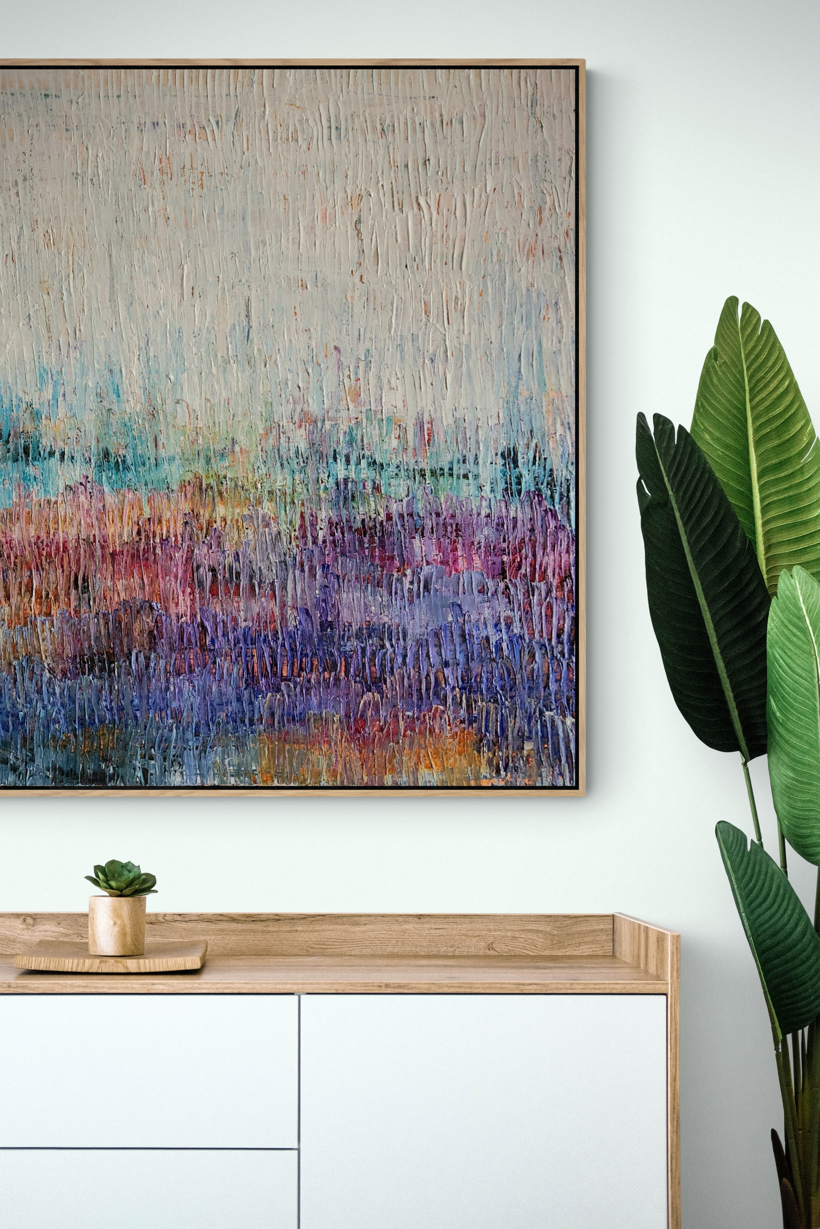 White Wooden Cabinet And Large Plant