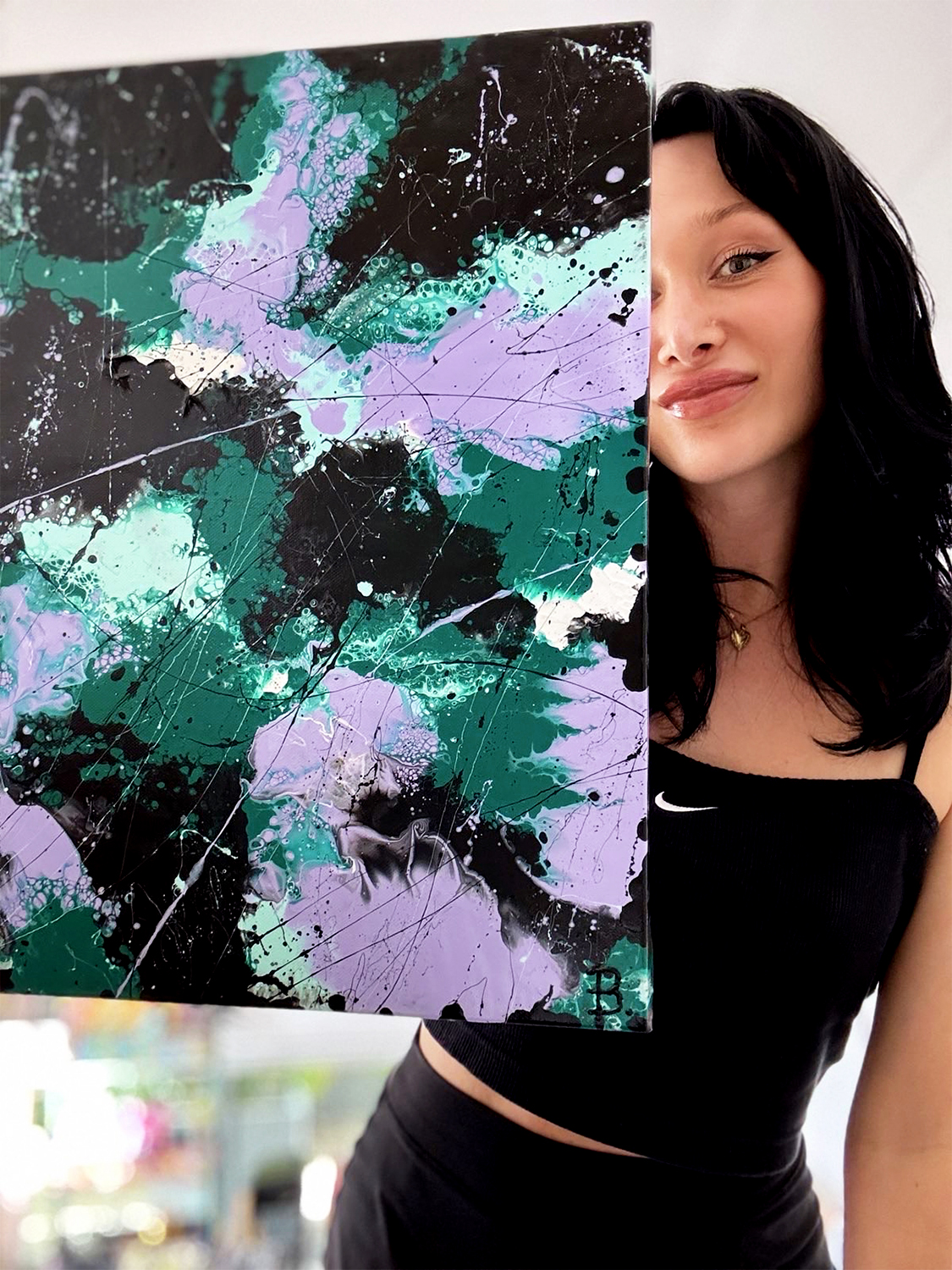 Bridget Bradley Holds One Of Her Forest Paintings