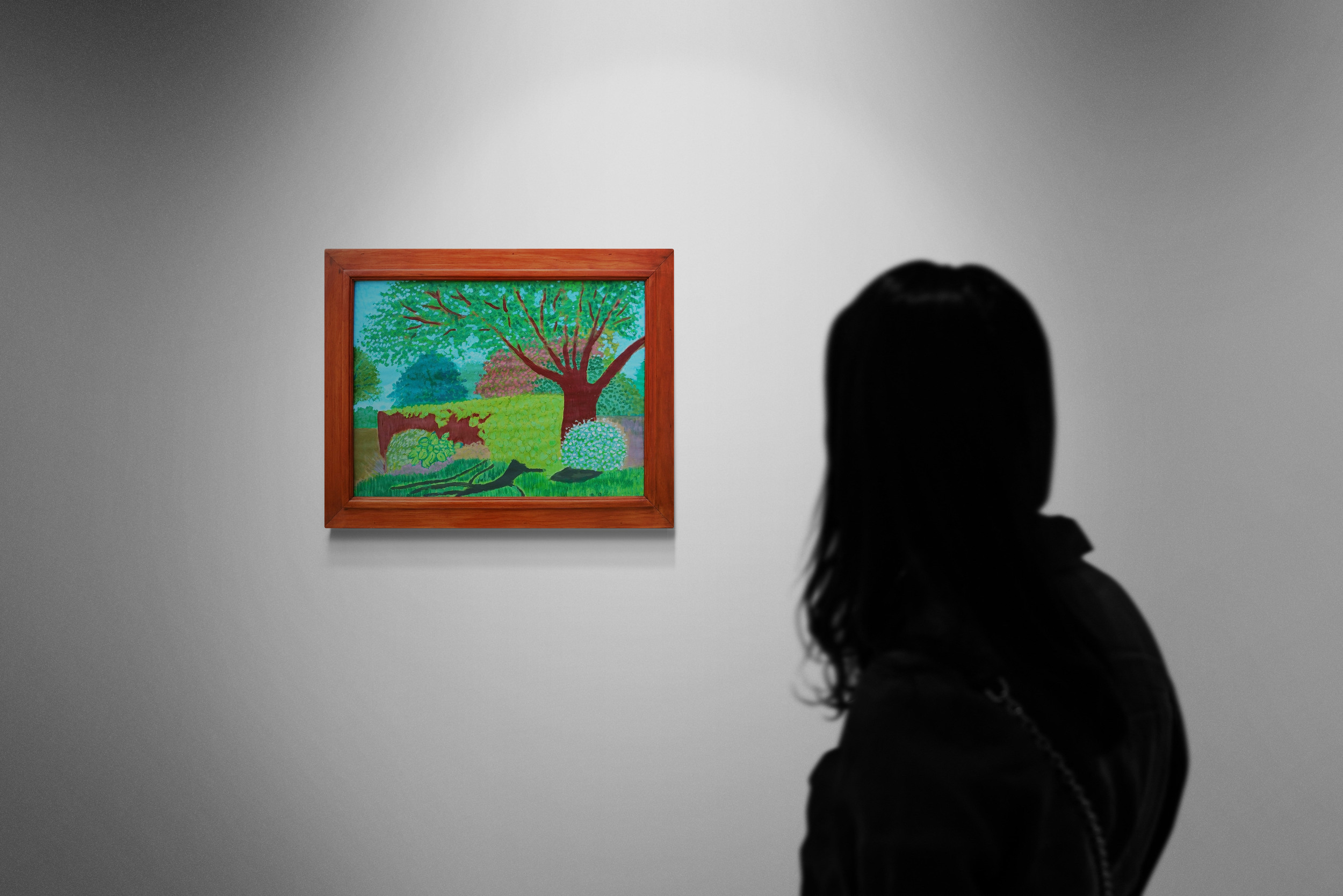 Woman Looking At Gallery Wall