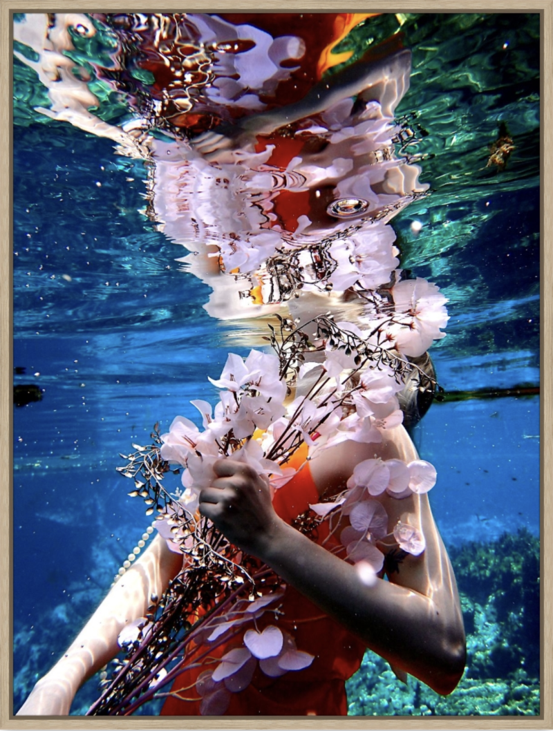 The blossoms pale, in fingers white