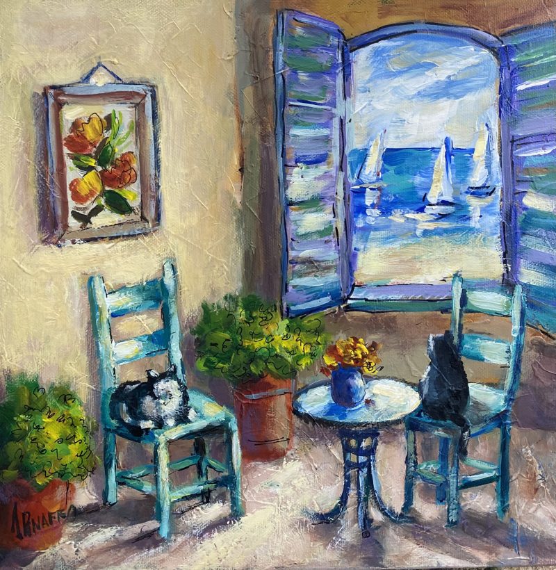 Cats enjoying the sea view