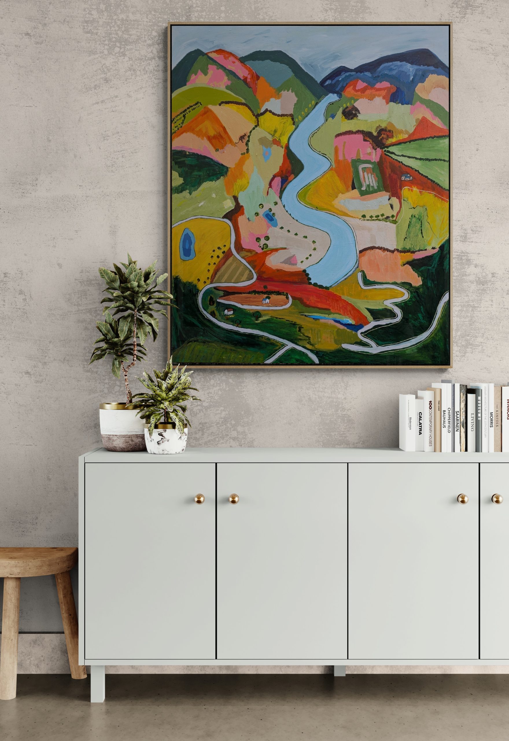 Potted Plants And Books Sitting On A Cabinet