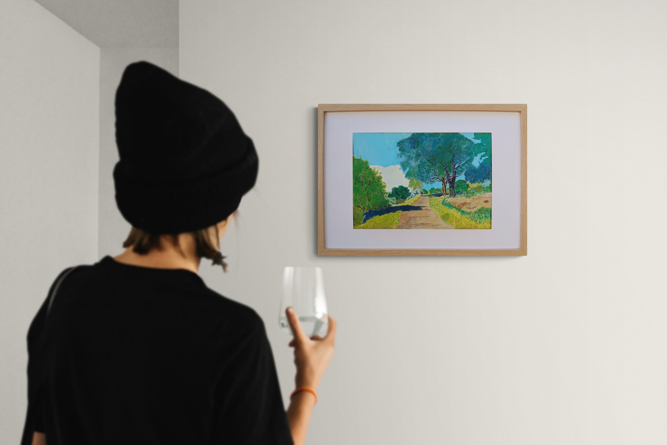 Close Up Of A Woman Next To A Gallery Wall