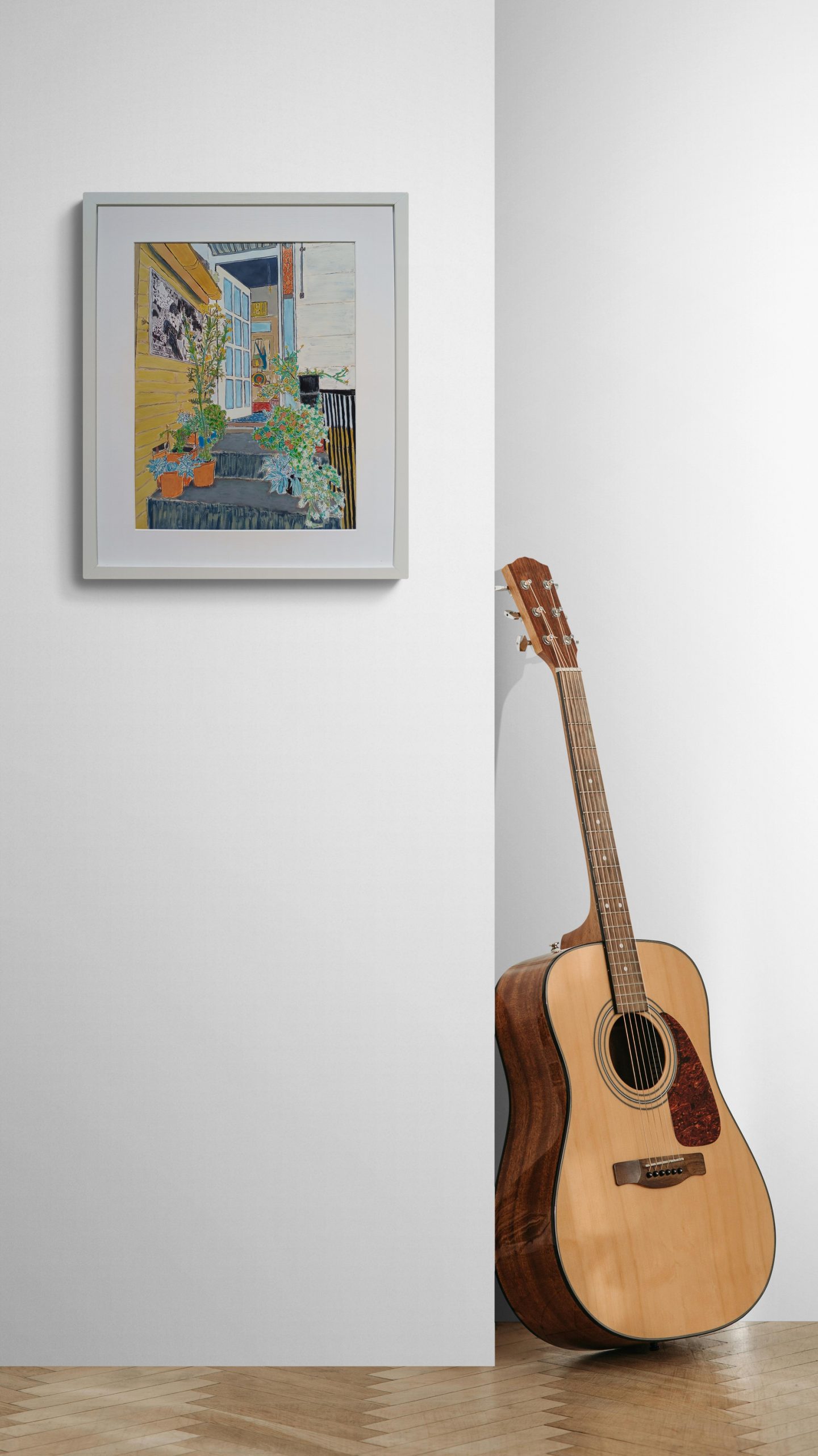 A Guitar Leaning Against An Empty Wall
